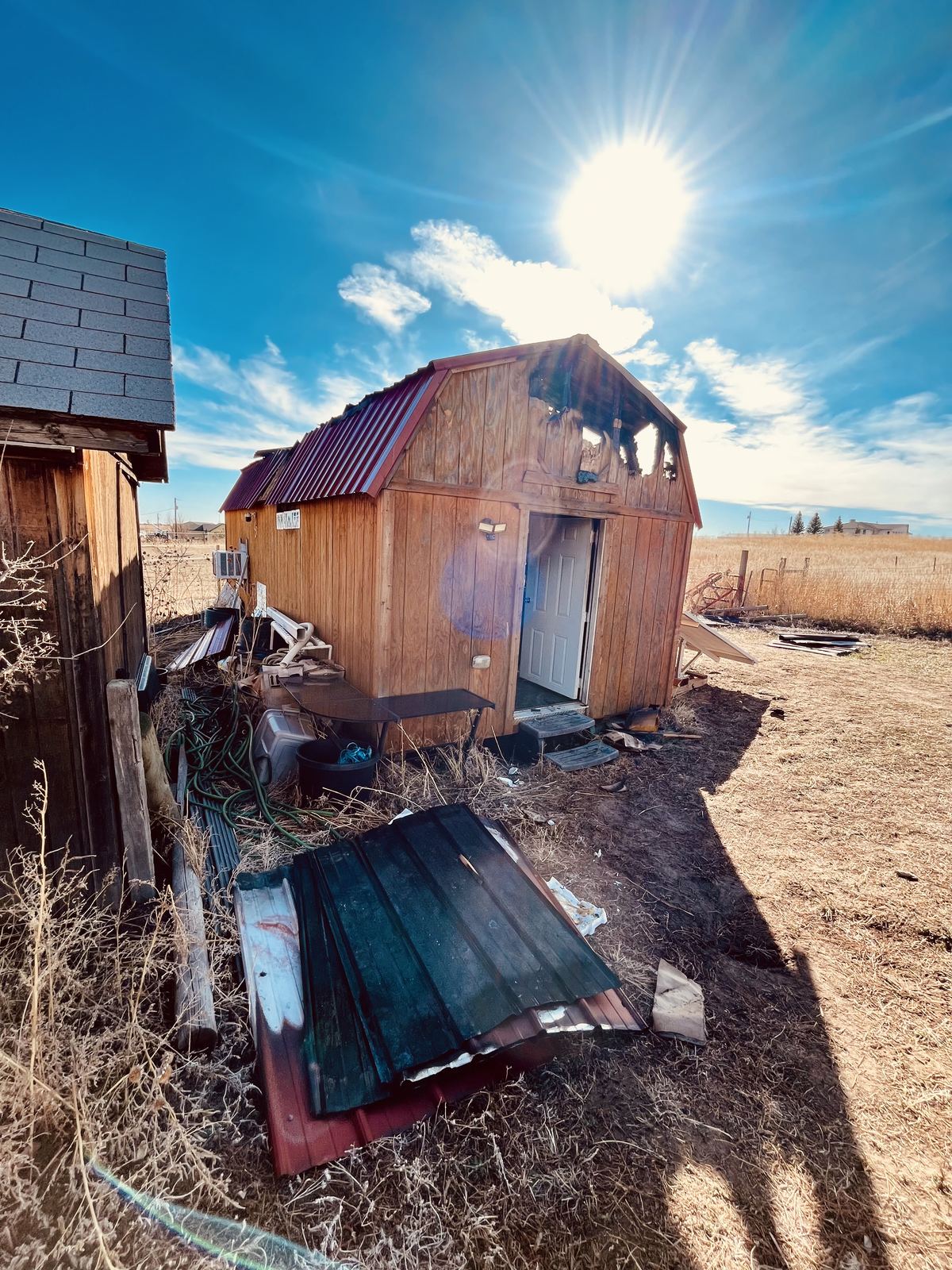 Barn fire roof damage before tarping
