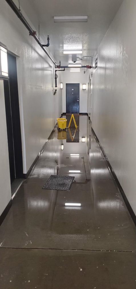 Large-scale water damage response in a commercial hallway
